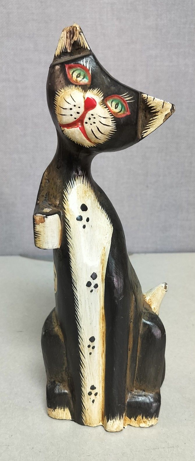 Hand-carved and hand-painted wooden cat figurine
