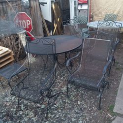 Wrought Iron Patio Set Consisting Of Table With Four Wrought Iron Rockers
