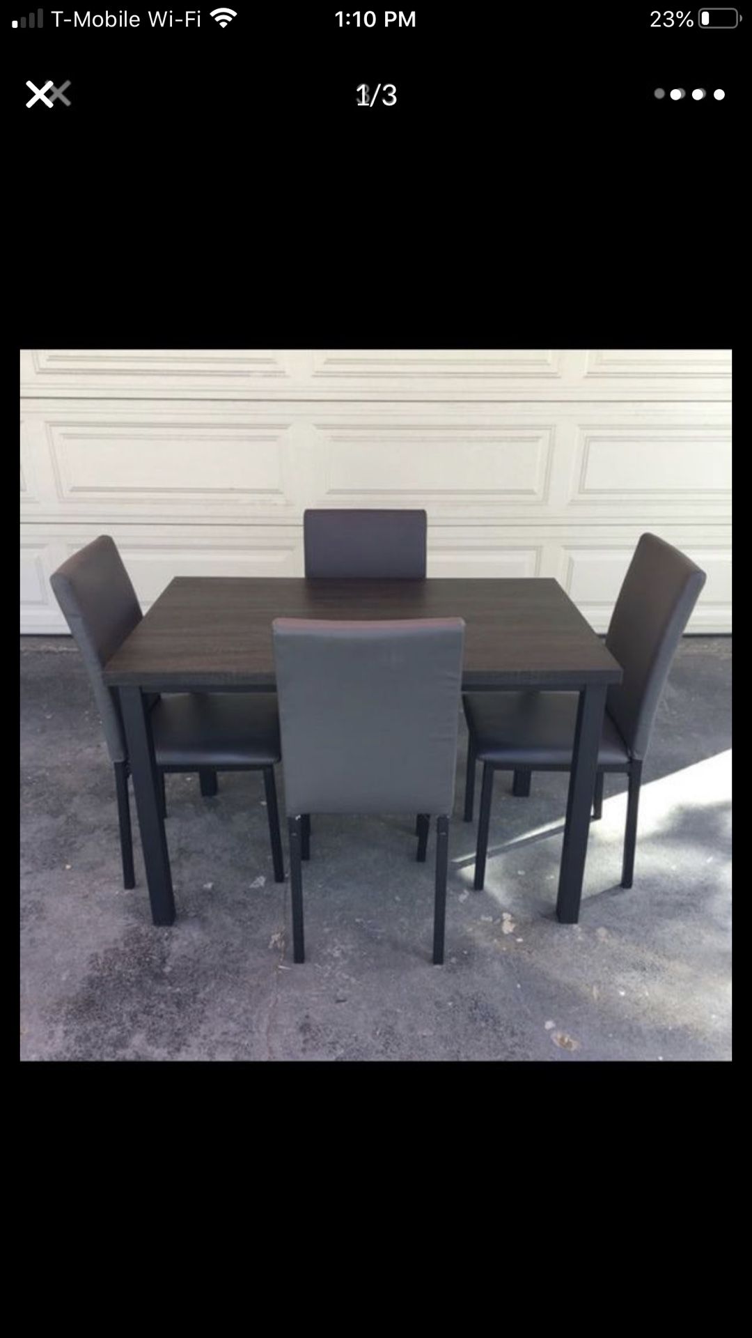 Dark grey and brown table with 4 chairs