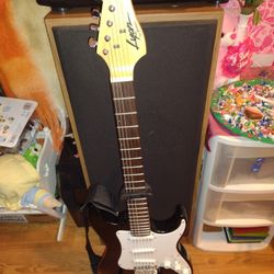 GUITARRA. ELECTRICA.  CON.  BASE