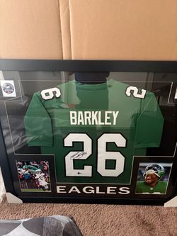 Beautiful Philadelphia Eagles Saquon Barkley #26 framed jersey display featuring the jersey, Barkley photos, action shot, and championship Eagles memo