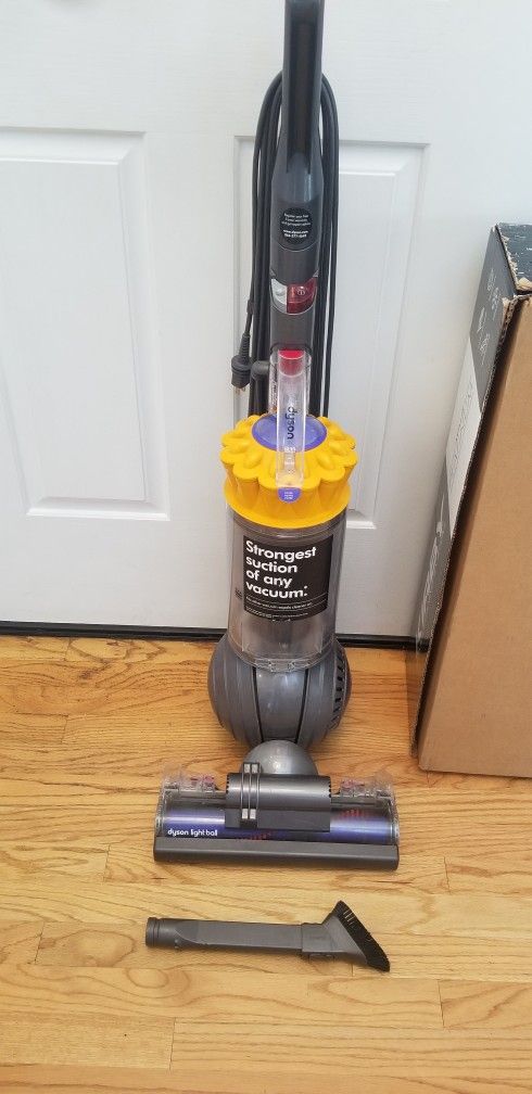 NEW cond DYSON VACUUM WITH ATTACHMENTS. , WORKS EXCELLENT. , IN THE BOX