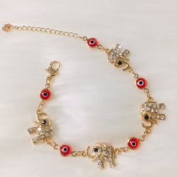 Bracelet Elephants gold plated with red stones
