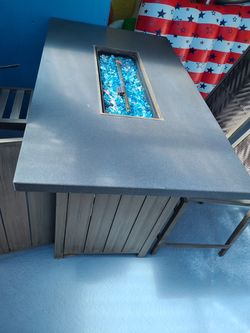 Outdoor pub fire table & 4 set of chairs with 2 storage racks.