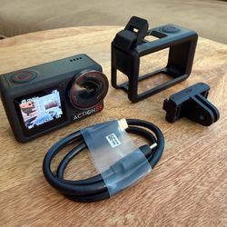 DJI Osmo Action 5 Pro 4K Action Camera with protective cage