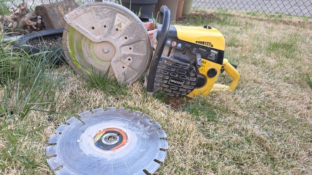 14in Waker Concrete Saw. Works Great. Comes With Two Good Diamond Discs.