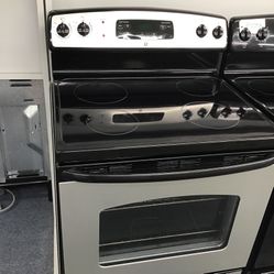 GE 4 Burner Glass Top Black And Stainless Steel Range. 1 year Warranty 