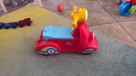 Fisher-Price Laugh & Learn Ride-On Scooter Toy