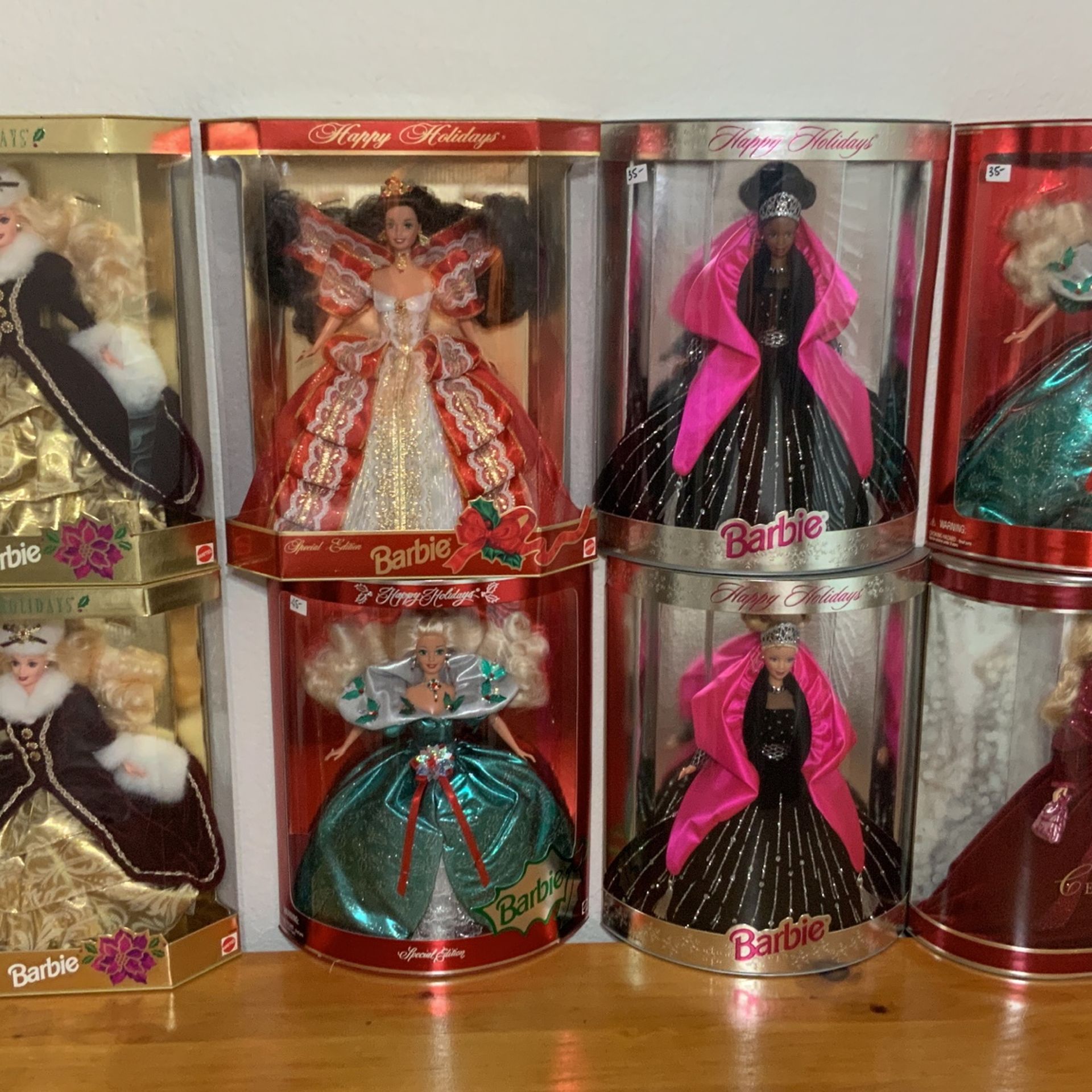 VINTAGE HAPPY HOLIDAY BARBIES , 1997 THRU 2002. ALL IN UNOPENED BOXES AND ORIGINAL SEALS. (NO LONGER AVAILABLE)