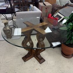 Round dining table with a glass top W/solid wood pedestal base.