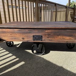 FirsTime & Co. Brown Factory Cart Coffee Table with Wheels, Vintage Center Table for Living Room, Rectangular, Wood, Farmhouse,