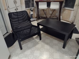 Black IKEA table and black IKEA mesh chair