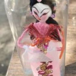 Vintage Asian Doll In Glass