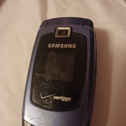 Old Cell Phones And Blue Tooth Ear Pierce 