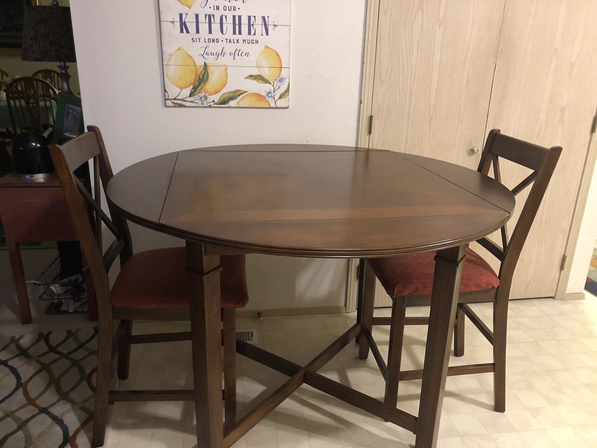 Dining Round/square with sides down all wood table and two chairs excellent used condition