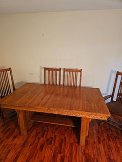 Solid oak mission dinning table and chairs,  good condition, $600