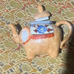 vintage 1930s-era Japanese lusterware ceramic teapot shaped like an elephant with its trunk up.