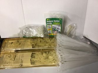 Large lot of Christmas lite stakes and gutter clips/hangers