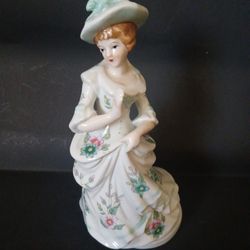 Vintage Porcelain Victorian Lady Figurine in Flowered Dress Music Box (8.5" tall)
*Music box works*