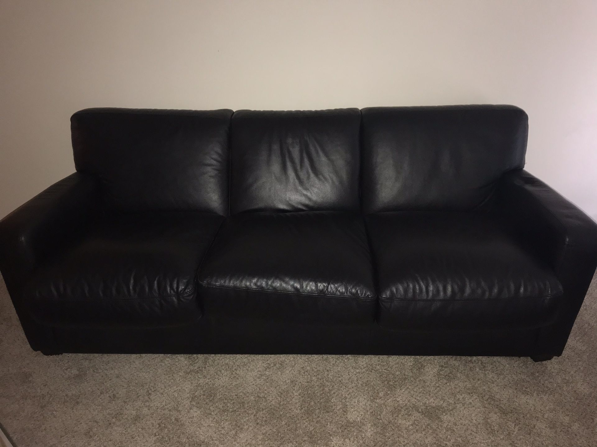 Black leather fold out couch
