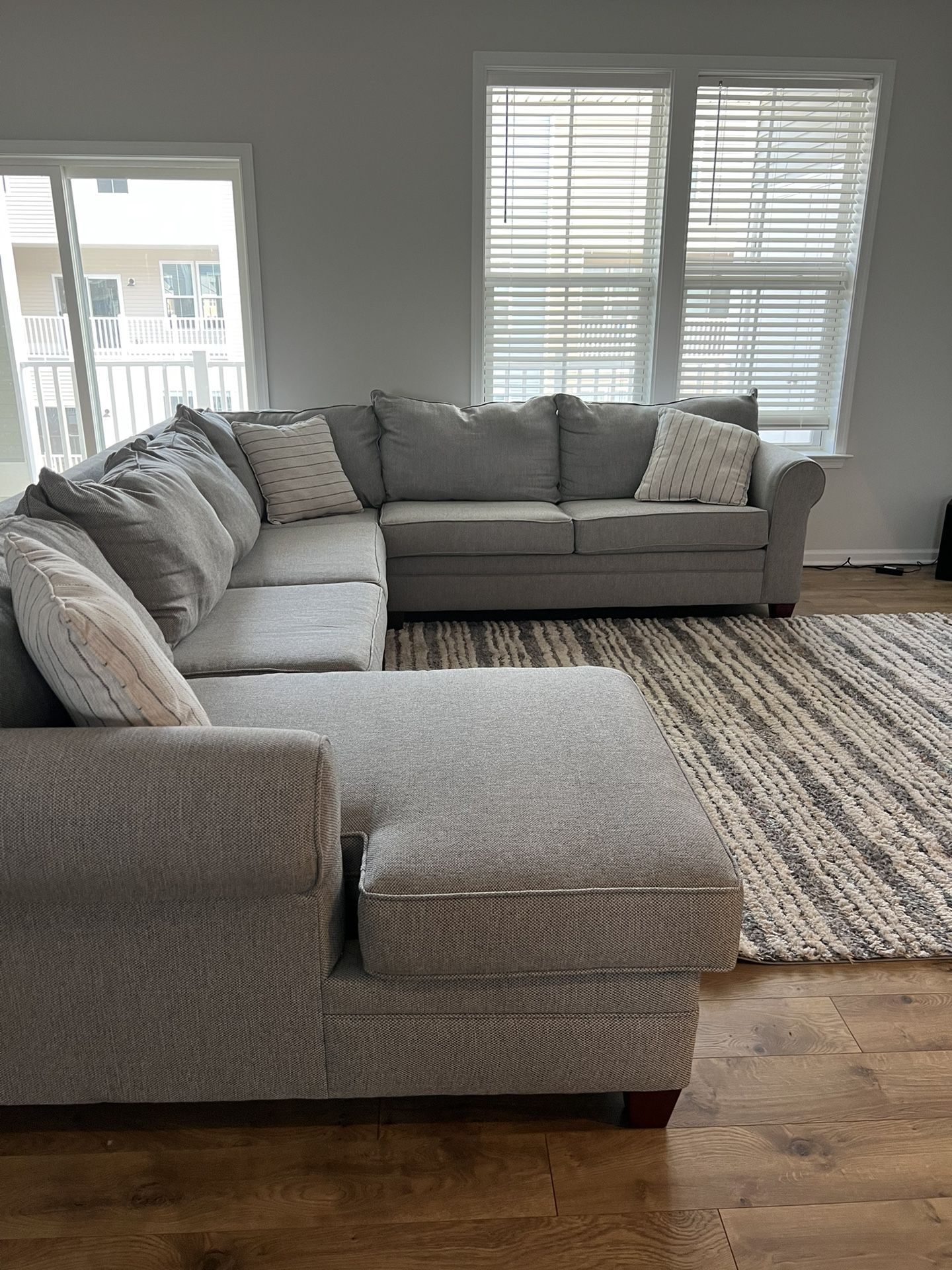 Newly Purchased Grey Sectional Sofa and Area Rug