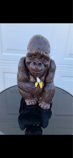 Gorilla holding banana statue