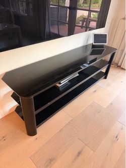 Glass top entertainment console