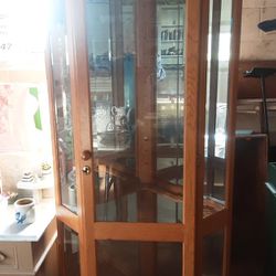 Solid Wood Curio Cabinate. Fits In Corner  7 Or 8 Glass Shelves Great Shape Lited Must Pick Up Has A Lock On Door
