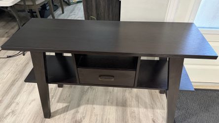 Dark wood console table with drawer