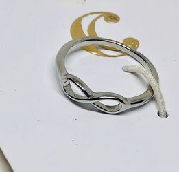 Charming Charlie silver infinity ring new on a card