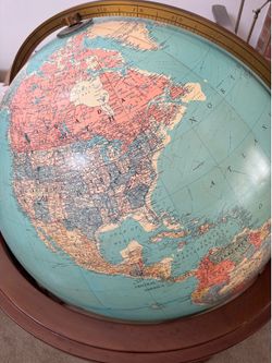 Large light up globe in furniture pedestal