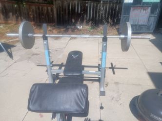 Weight bench with bar and 2 45lbers