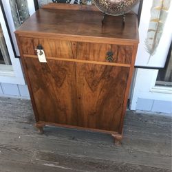 Two Shelves In Lockable Cabinet With A Drawer On Top