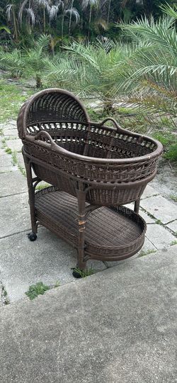 Pottery Barn brown wicker bassinet