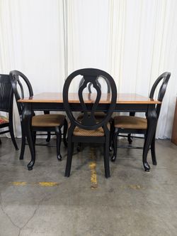 Two-Tone Wood Dining Table with Black Chairs