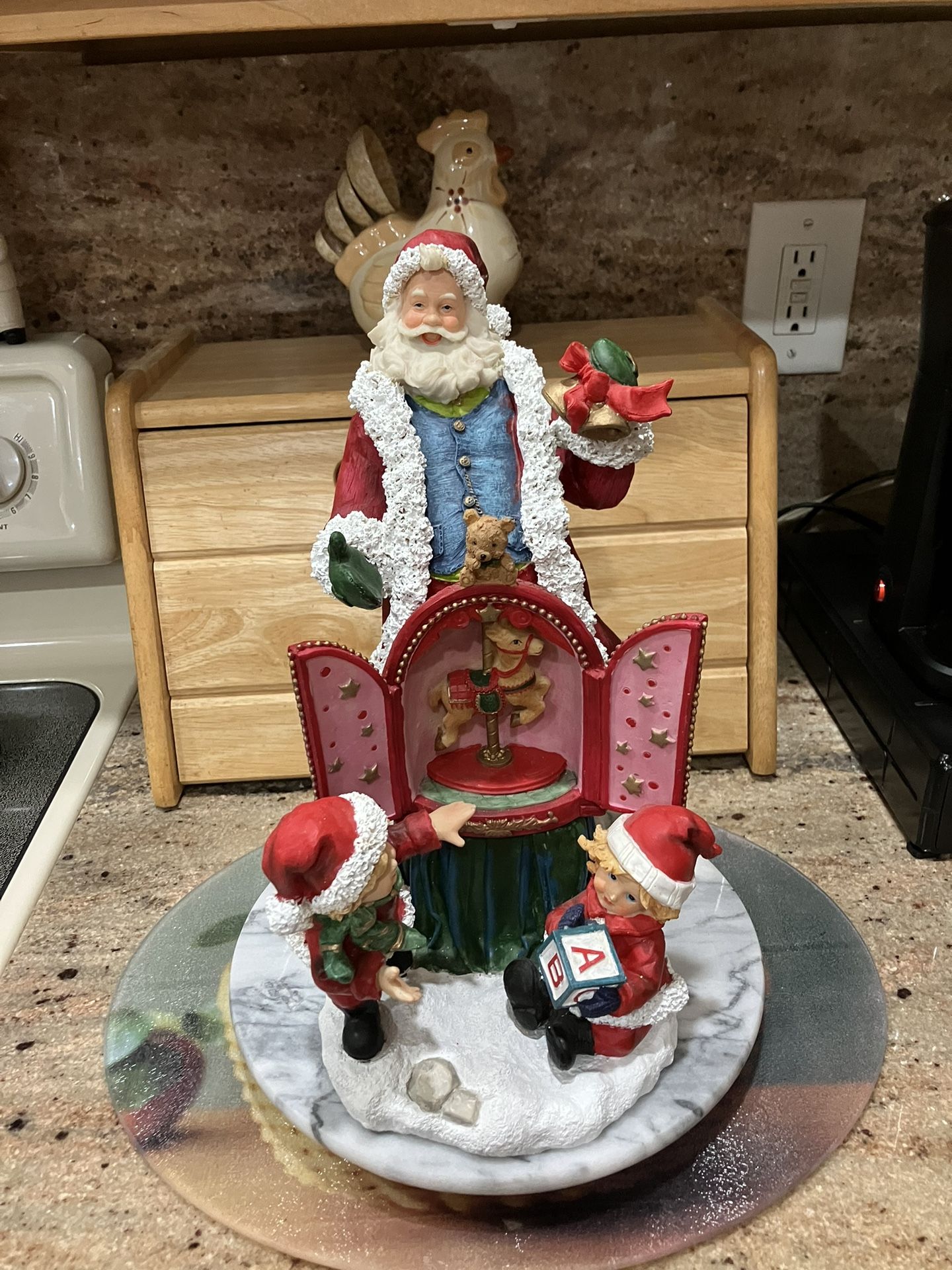Santa clause 12 inch figure  with children, a bear and a carousel horse…