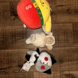 Mixture Of Stuffed Toys: Pompompurin, Cat, And Praying Lamb.