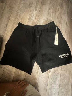 Essentials, fear of God, short and T-shirt set in all black or with white logo.