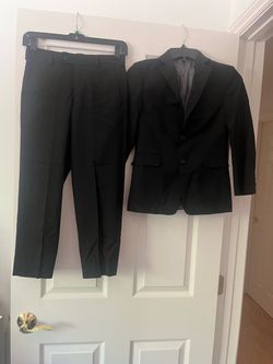 Joseph Abboud Boys 2-Piece Suit  Black Joseph Abboud 2-piece suit is a size 8R. The material is 44% wool and 2% elastane. The pants have a 13.5-inch w