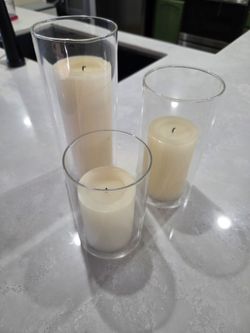 Tiered candles with glass cylinders