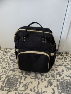 Diaper Bag Expanding Into A Change Pad And Sleeping Bed With Cushion