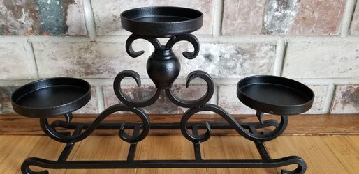 Brandnew black Rouge Iron Candle holder very sturdy.