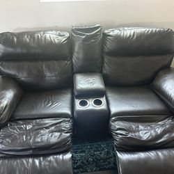 2 seat leather couch with center console & 2 leg rests