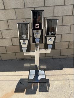 Three 1inch capsule toy machines 2 fifty cent & 1, 25 cents on chrome cactus stand with locks and key