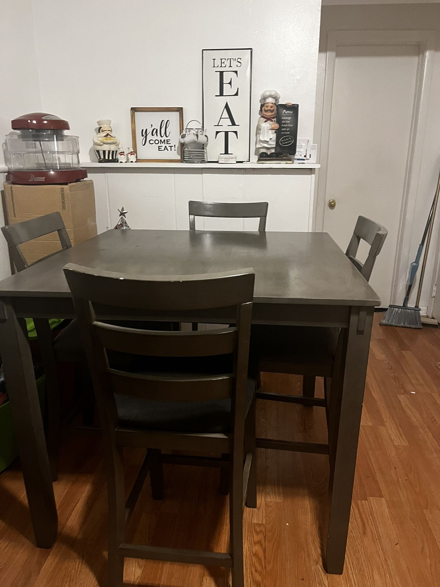 Table with four chairs in fair condition