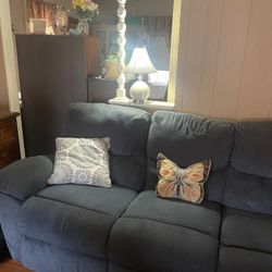 Dual Manual Recliner. Pretty Blue Material In Great Condition. Need Gone By 10/14!!