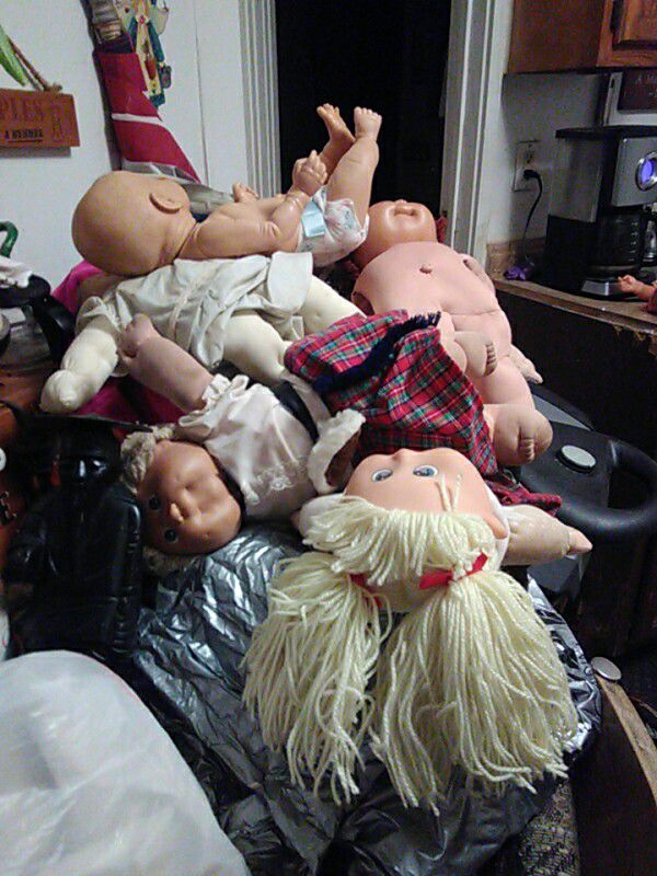 Got a lot lot of cabbage patch dolls in a lot lot of clothes in shoes abox 2 big trash bags full