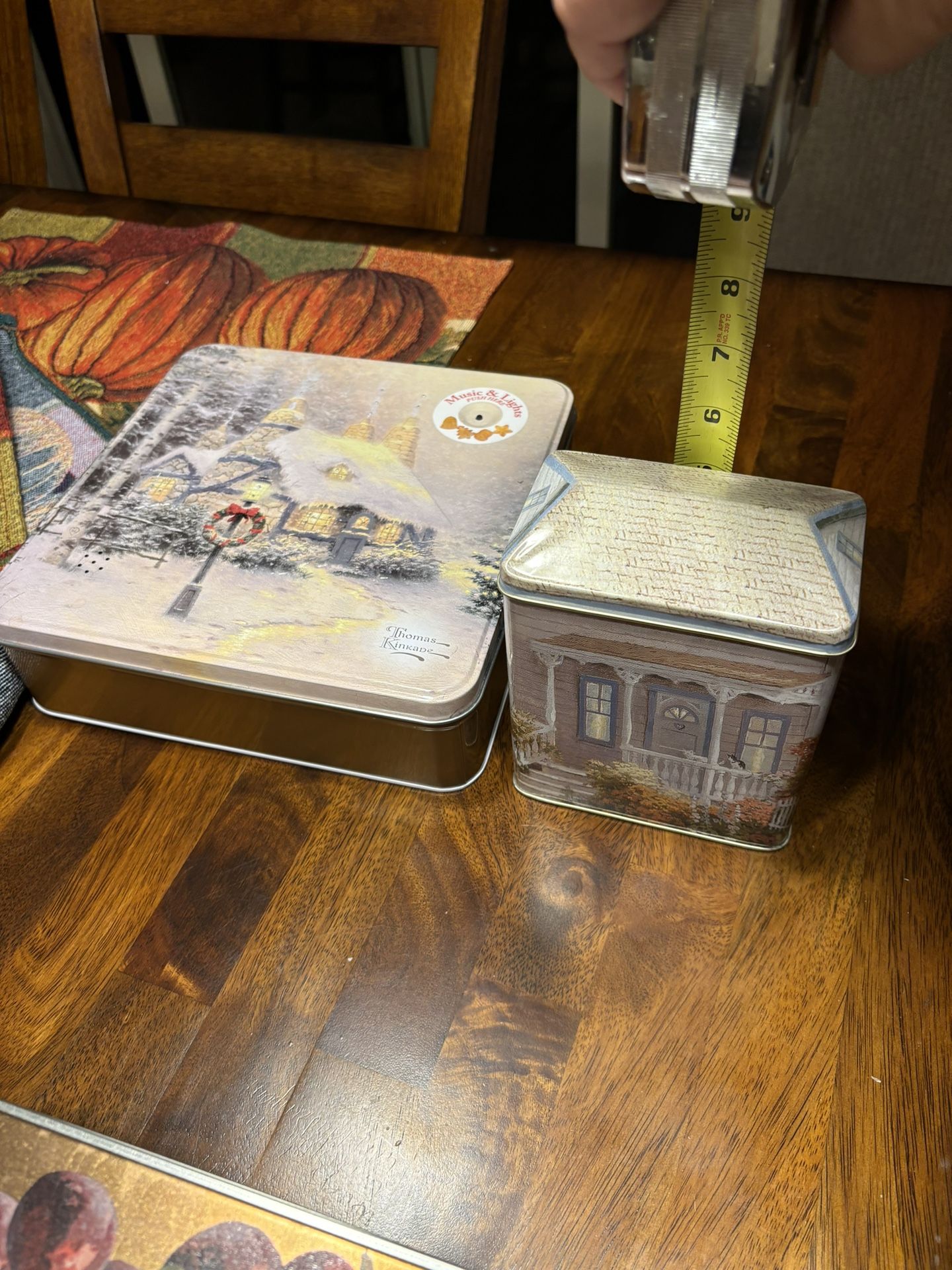 Vintage Thomas Kinkade Christmas Cookie Tin Plays Music & Lights Up 1997 plus Smaller Thomas Kinkade tin.