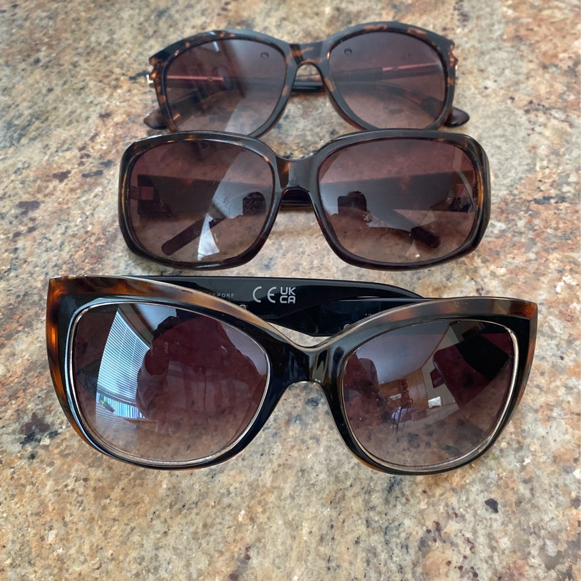 Three Pairs Of Sunglasses