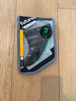 John John Florence medium features surfboard fins